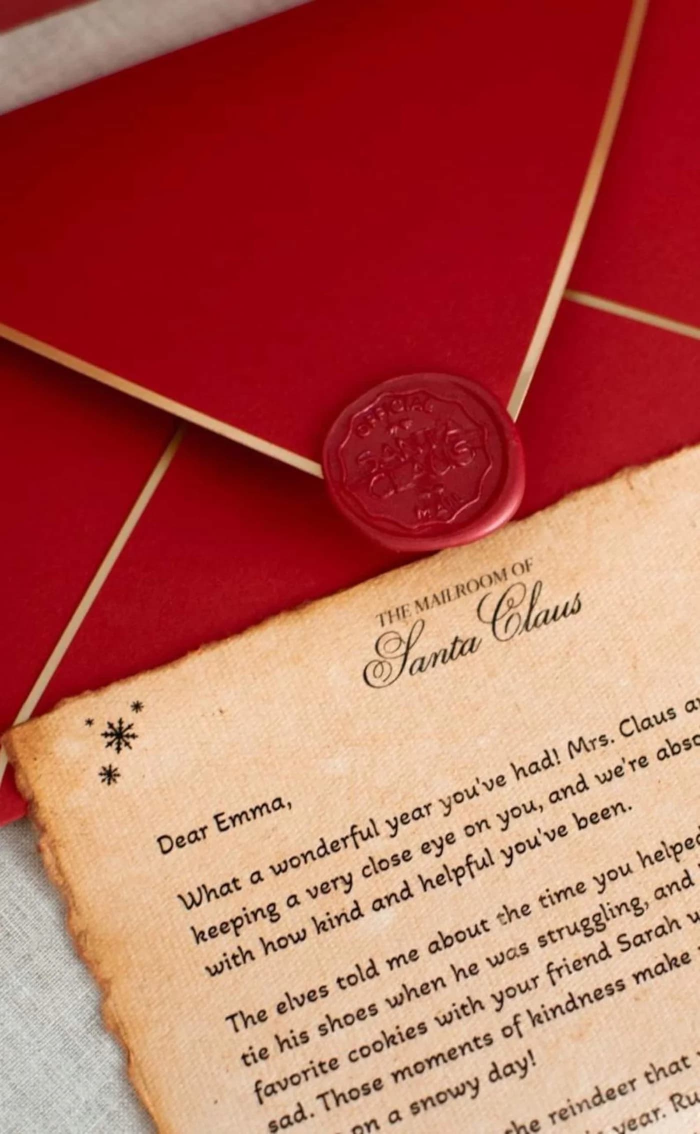 A round red wax seal on the back of a red envelope edged in gold